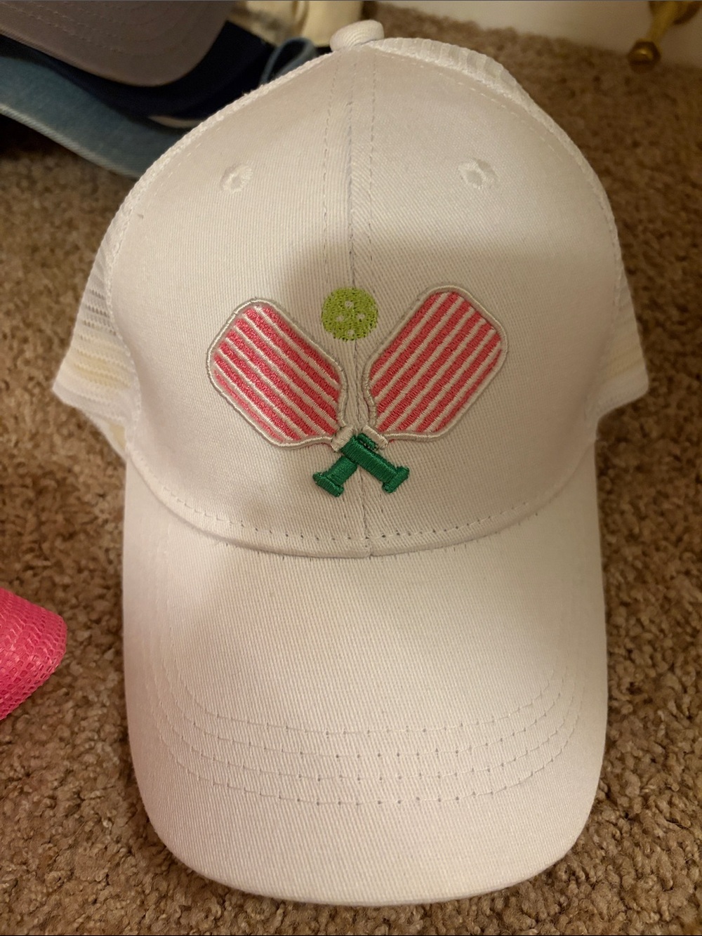 White hat with Pink Striped Paddles and Green Ball